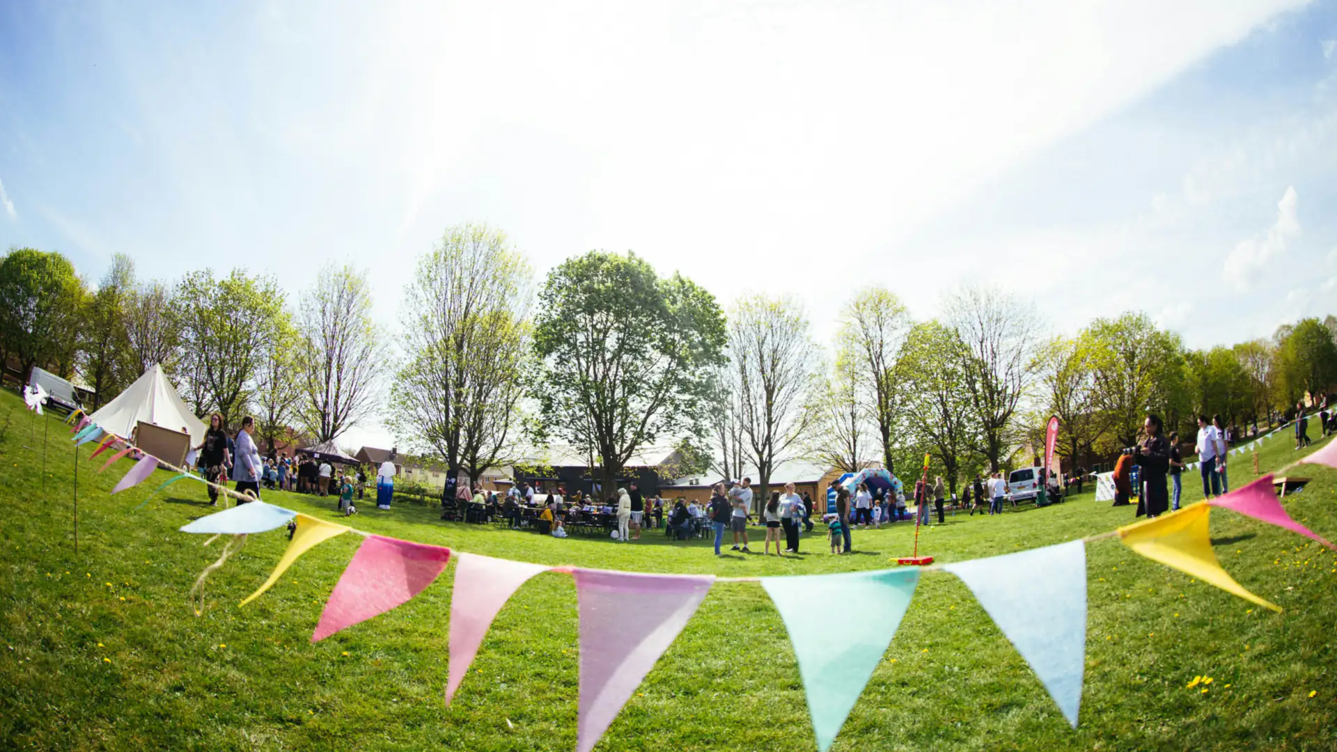 Bunting over a lawn at an outdoor family fun day